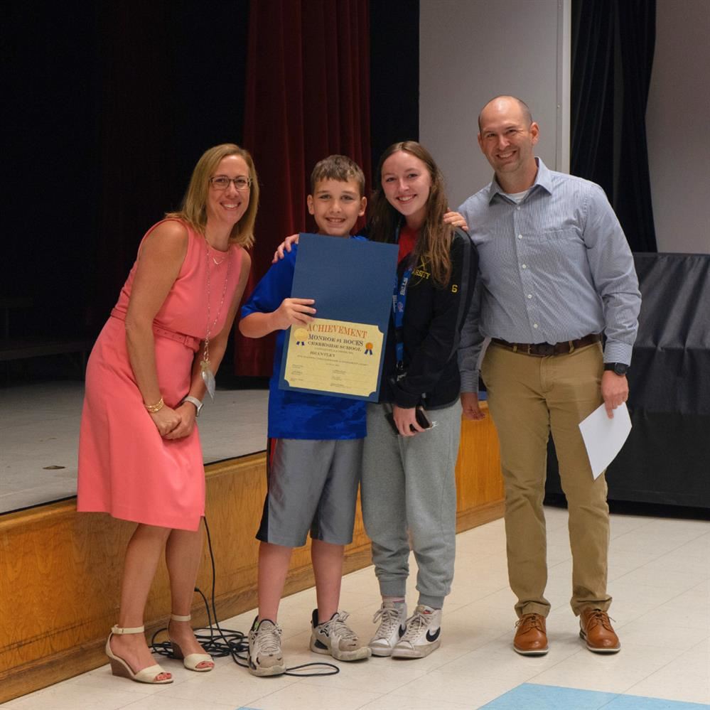  Picture of a Creekside award winner and his supporters.
